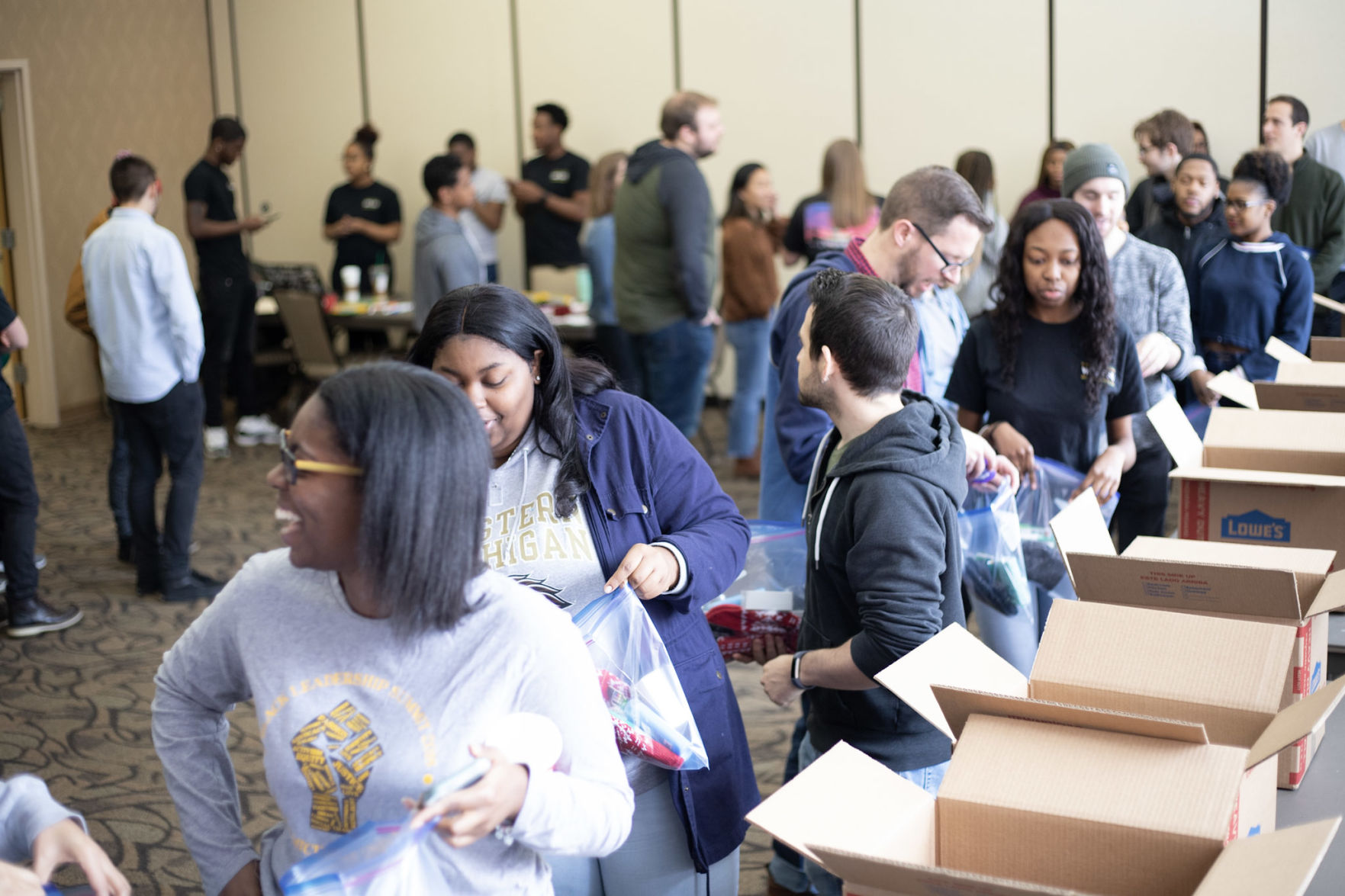 Students lined up to help BSU fill packages for the homeless which included hygiene and basic necessity items.